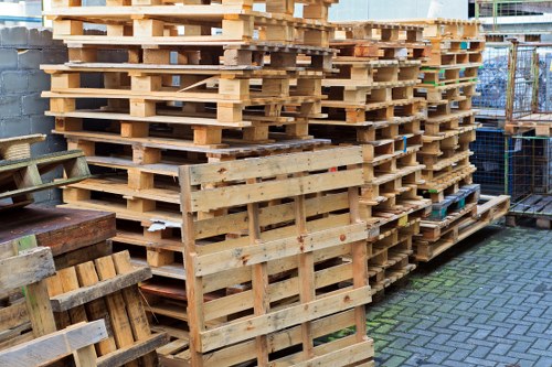 Crew loading furniture into a van on a Hampstead street